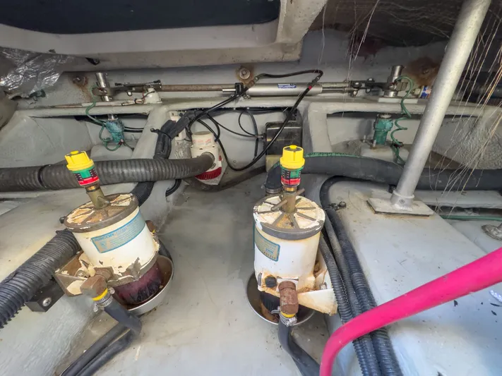 Bay Cruzin Yacht Photos Pics Engine room of 2004 Mainship Pilot 34 with hoses and filters.