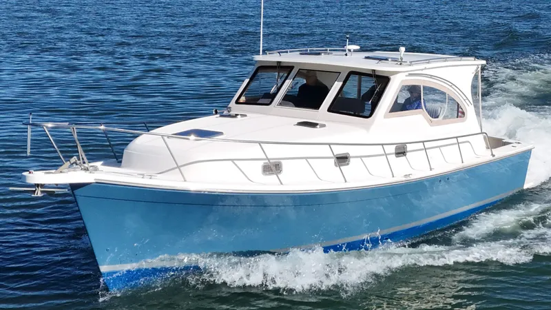 Bay Cruzin Yacht Photos Pics 2004 Mainship Pilot 34 boat cruising on calm waters.