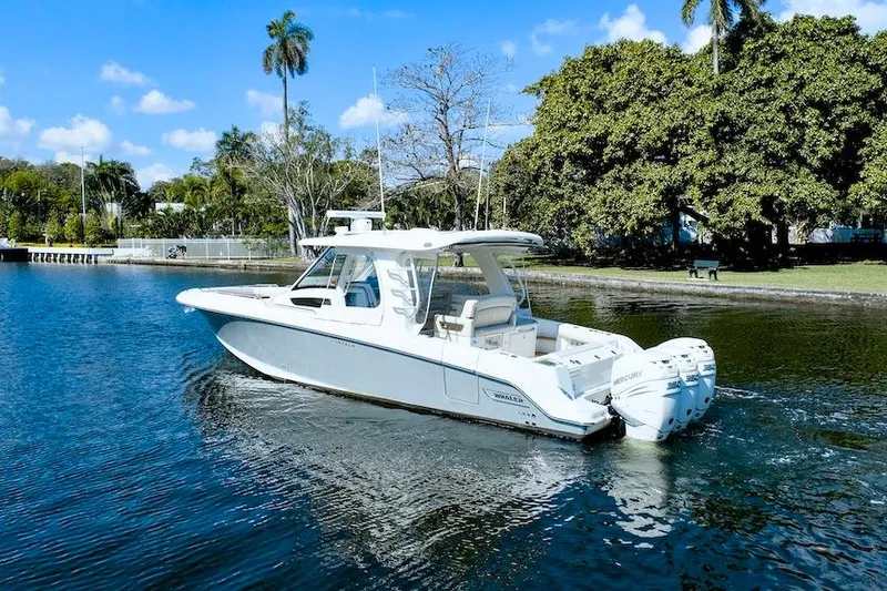 350 Realm Yacht Photos Pics 2019 Boston Whaler 350 Realm boat cruising on a scenic waterway.