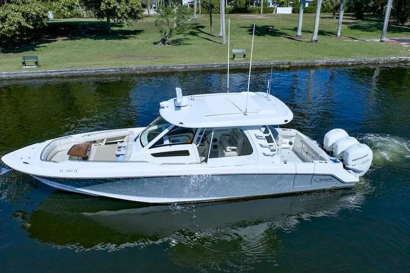 350 Realm Yacht Photos Pics 2019 Boston Whaler 350 Realm boat cruising on a calm waterway.