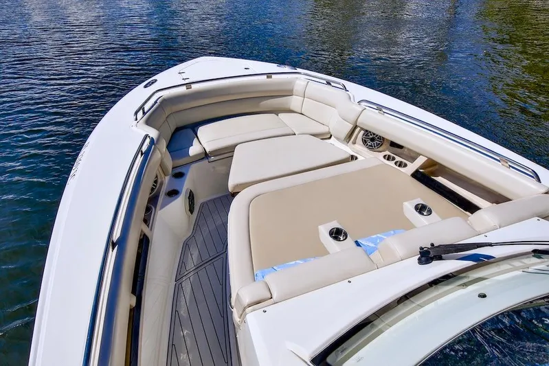 350 Realm Yacht Photos Pics 2019 Boston Whaler 350 Realm boat interior with cushioned seating and cup holders.
