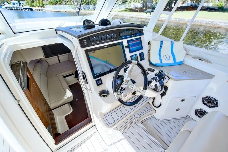 350 Realm Yacht Photos Pics 2019 Boston Whaler 350 Realm cockpit with advanced navigation system and luxurious seating.