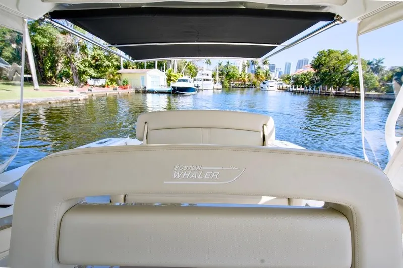 350 Realm Yacht Photos Pics 2019 Boston Whaler 350 Realm boat interior with waterfront view.