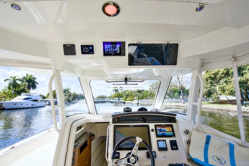 350 Realm Yacht Photos Pics Interior view of 2019 Boston Whaler 350 Realm boat cockpit with advanced navigation systems.