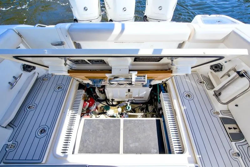 350 Realm Yacht Photos Pics 2019 Boston Whaler 350 Realm engine compartment with open hatch, showcasing mechanical components.