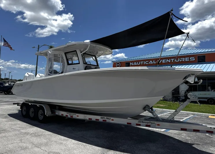  Yacht Photos Pics 2024 Sea Pro 322 DLX boat on trailer at Nautical Ventures dealership.