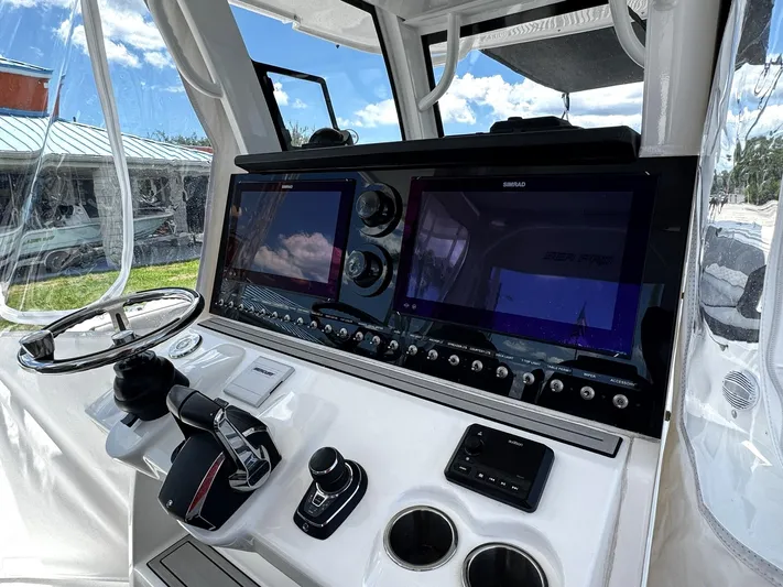  Yacht Photos Pics 2024 Sea Pro 322 DLX boat dashboard with advanced controls and navigation screens.