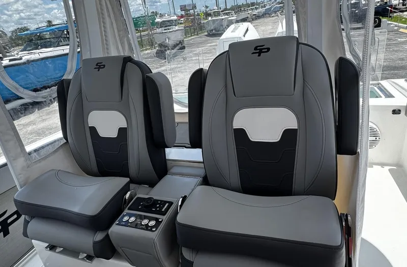  Yacht Photos Pics 2024 Sea Pro 322 DLX boat seats with modern design and control panel.