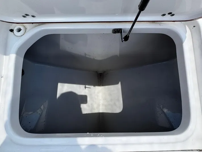  Yacht Photos Pics Open storage compartment of 2024 Sea Pro 322 DLX boat, showing interior space.