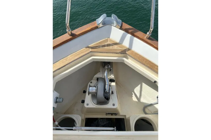  Yacht Photos Pics Anchor compartment of 2005 Mochi Dolphin 51 yacht with polished metal fittings.