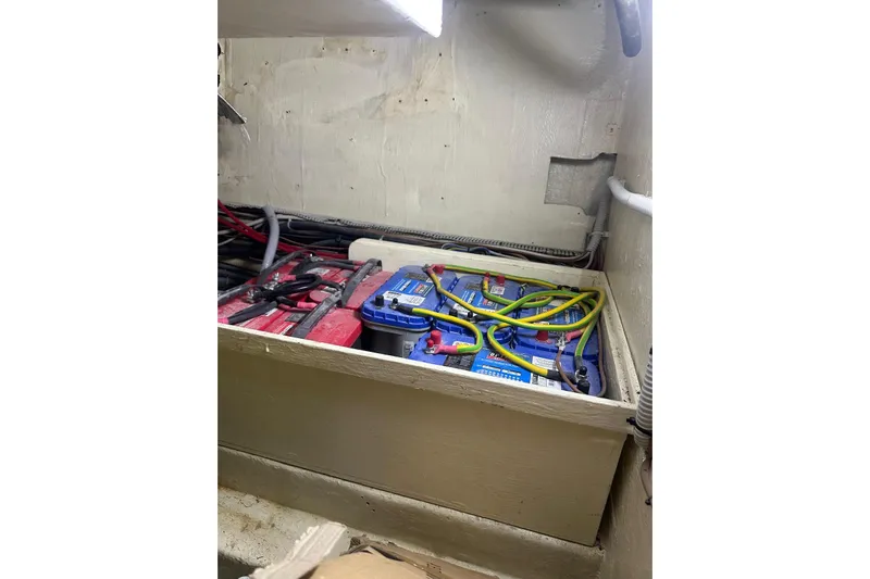  Yacht Photos Pics Battery compartment of a 2005 Mochi Dolphin 51 yacht with cables and connections.
