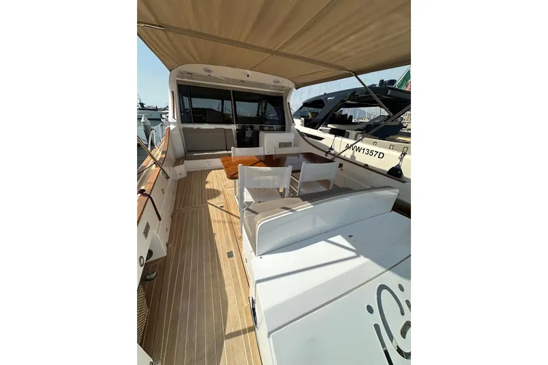  Yacht Photos Pics 2005 Mochi Dolphin 51 yacht with spacious deck and seating area.