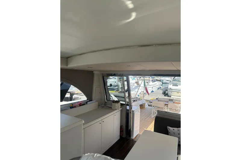  Yacht Photos Pics Interior view of 2005 Mochi Dolphin 51 yacht with marina backdrop.