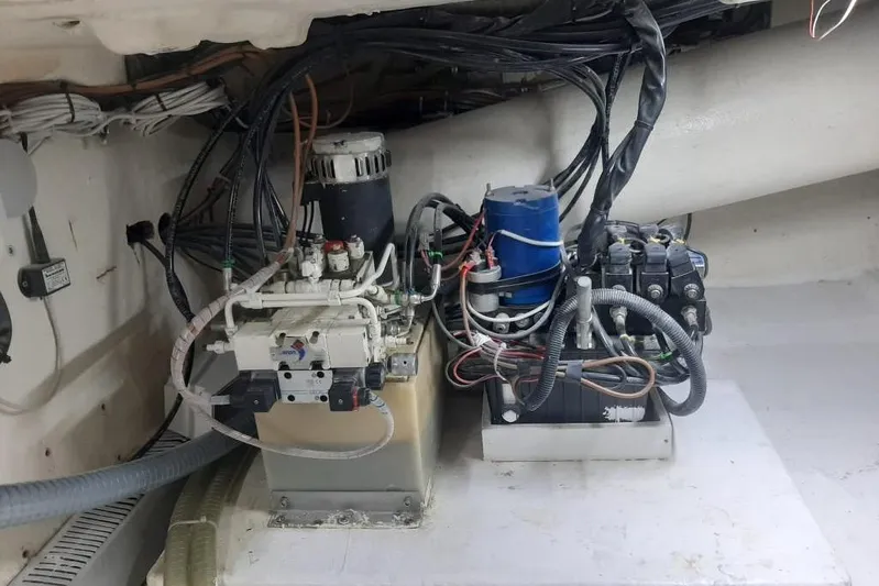  Yacht Photos Pics Engine room of 2005 Mochi Dolphin 51 yacht with complex wiring and machinery.