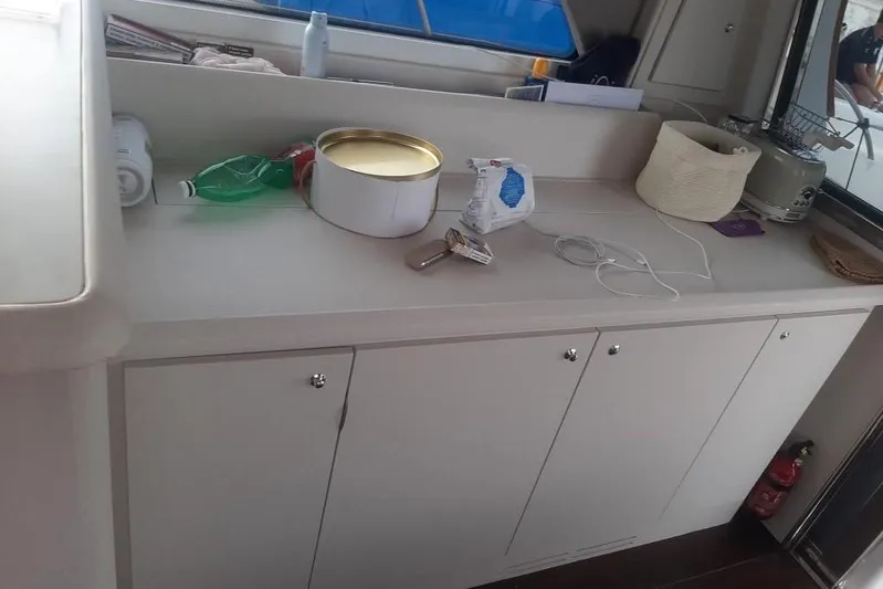  Yacht Photos Pics Interior of 2005 Mochi Dolphin 51 yacht with countertop and storage cabinets.