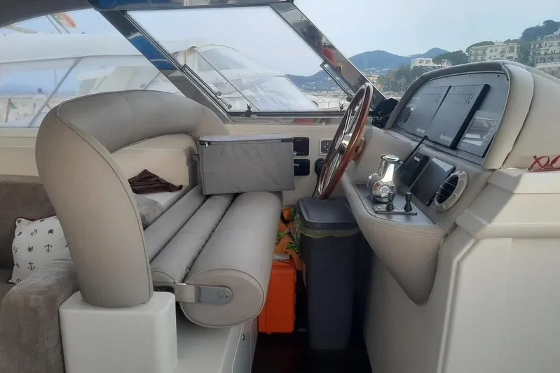  Yacht Photos Pics Interior of a 2005 Mochi Dolphin 51 yacht cockpit with steering wheel and navigation equipment.