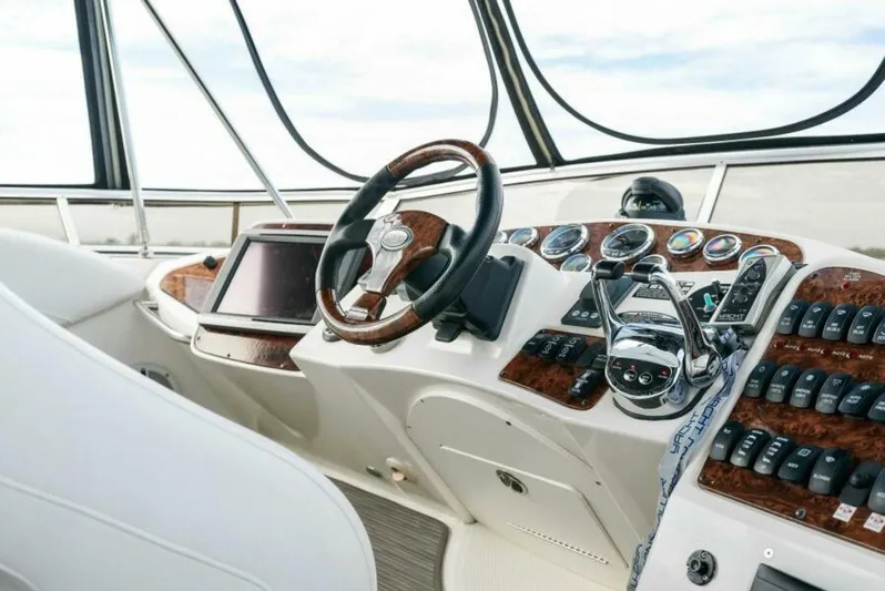 M&m Yacht Photos Pics Helm of 2008 Meridian 459 Motoryacht with wood accents and modern controls.