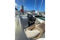 2023 Quicksilver Activ 675 Open boat interior with steering console and seating.