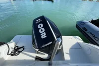 2023 Quicksilver Activ 675 Open with Mercury 100 HP engine on calm water.