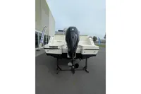 2023 Quicksilver Activ 675 Open boat displayed outdoors, rear view.