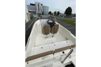2023 Quicksilver Activ 675 Open boat interior with dual seats and steering console.