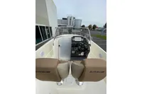 2023 Quicksilver Activ 675 Open boat interior with steering console and seats.