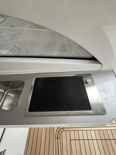 New Sessa C38 Yacht Photos Pics Modern kitchen area on 2024 Sessa Marine C38 yacht with grill and sink.