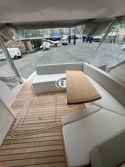 New Sessa C38 Yacht Photos Pics 2024 Sessa Marine C38 yacht interior with elegant seating and wooden table.