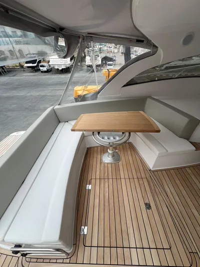 New Sessa C38 Yacht Photos Pics 2024 Sessa Marine C38 yacht interior with elegant seating and wooden table.
