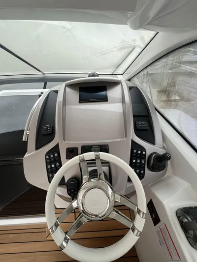 New Sessa C38 Yacht Photos Pics 2024 Sessa Marine C38 helm with modern controls and sleek design.
