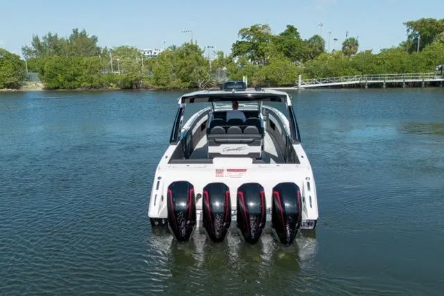  Yacht Photos Pics 2025 Cigarette 42' Auroris boat with multiple engines on a calm waterway.
