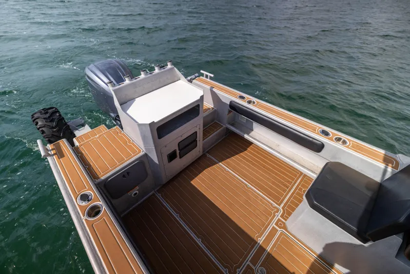 Latitude Yacht Photos Pics Sealegs 8.5M 2022 boat interior with wooden deck and seating on water.
