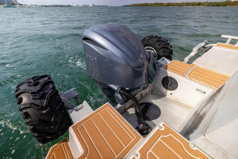 Latitude Yacht Photos Pics Amphibious Sealegs 8.5M boat with wheels and outboard motor on water, 2022 model.