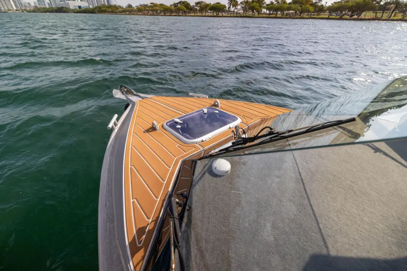 Latitude Yacht Photos Pics Sealegs 8.5M 2022 boat on water, featuring sleek deck design and cityscape background.