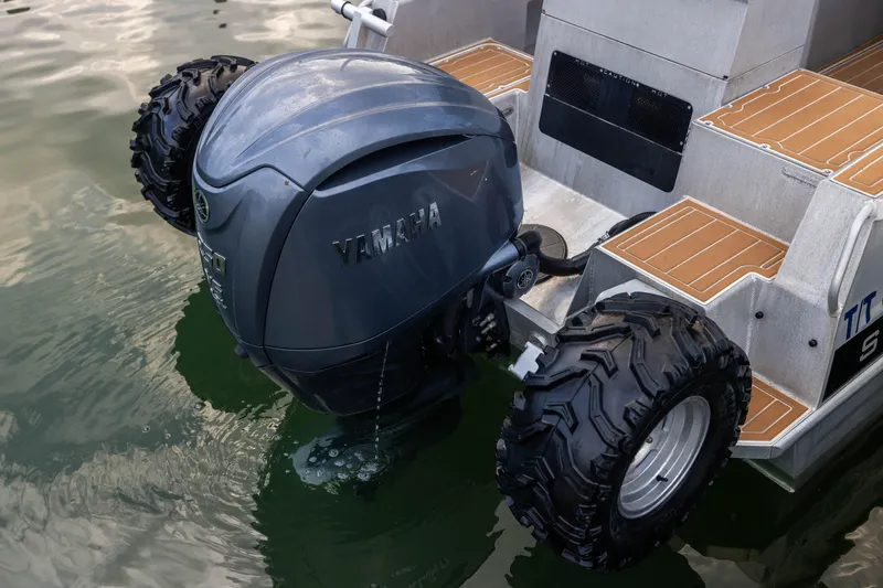 Latitude Yacht Photos Pics Sealegs 8.5M 2022 amphibious boat with Yamaha outboard motor and rugged wheels in water.