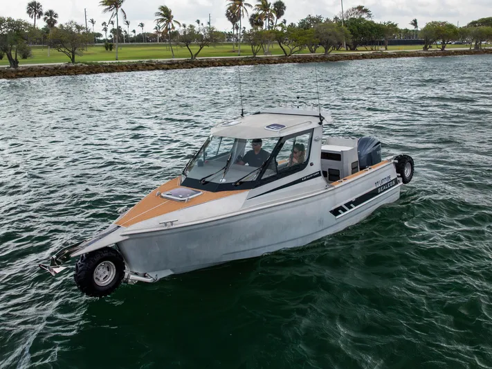 Latitude Yacht Photos Pics 2022 Sealegs 8.5M amphibious boat on water, featuring sleek design and modern technology.