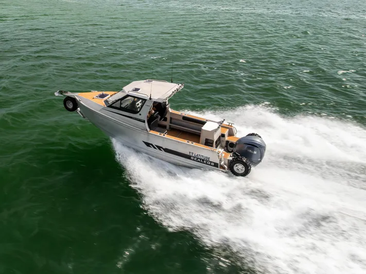 Latitude Yacht Photos Pics 2022 Sealegs 8.5M amphibious boat cruising on water, showcasing speed and versatility.