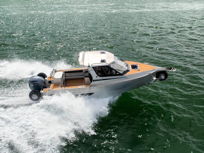 Latitude Yacht Photos Pics 2022 Sealegs 8.5M amphibious boat cruising on water, showcasing speed and versatility.