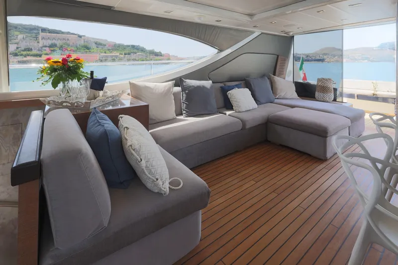 @last Yacht Photos Pics Luxurious interior of 2003 Leopard 24 yacht with plush seating and scenic ocean view.
