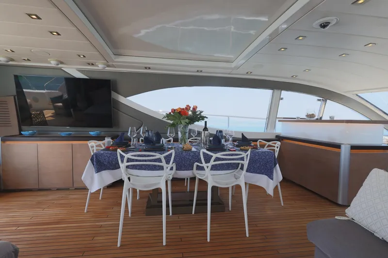 @last Yacht Photos Pics Luxurious dining area on 2003 Leopard 24 yacht with elegant table setting and ocean view.