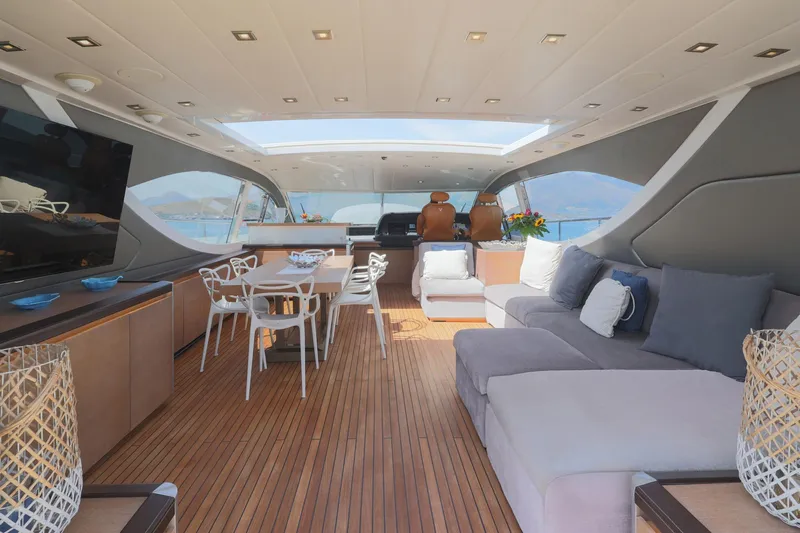 @last Yacht Photos Pics Luxurious interior of 2003 Leopard 24 yacht with modern seating and dining area.