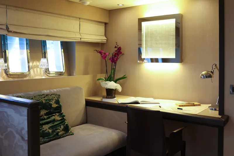 @last Yacht Photos Pics Luxurious interior of 2003 Leopard 24 yacht with elegant desk and seating area.