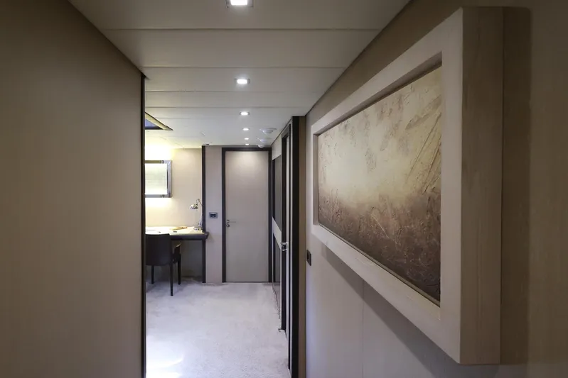@last Yacht Photos Pics Luxurious interior hallway of 2003 Leopard 24 yacht with elegant decor and artwork.