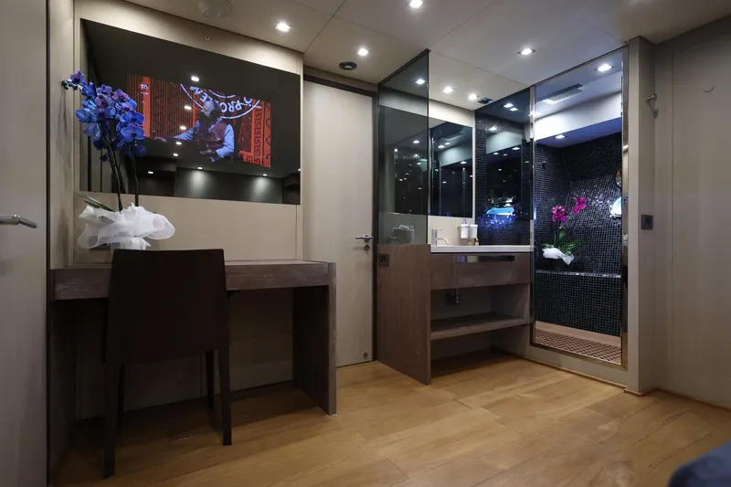 @last Yacht Photos Pics Luxurious interior of 2003 Leopard 24 yacht with elegant vanity and modern bathroom.