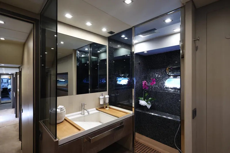 @last Yacht Photos Pics Luxurious bathroom interior on 2003 Leopard 24 yacht with modern fixtures and elegant design.