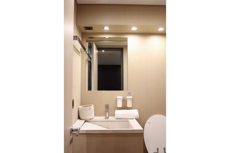 @last Yacht Photos Pics Luxurious bathroom interior on 2003 Leopard 24 yacht, featuring modern fixtures and elegant design.