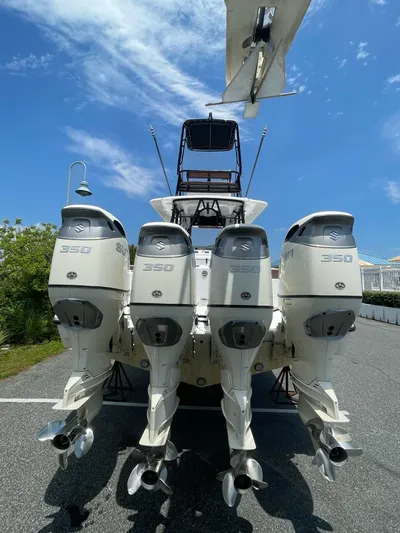  Yacht Photos Pics 2008 Yellowfin 42 boat with four powerful outboard engines, viewed from the rear.