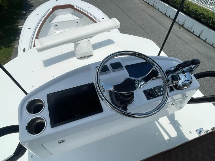  Yacht Photos Pics 2008 Yellowfin 42 boat helm with steering wheel and navigation controls.