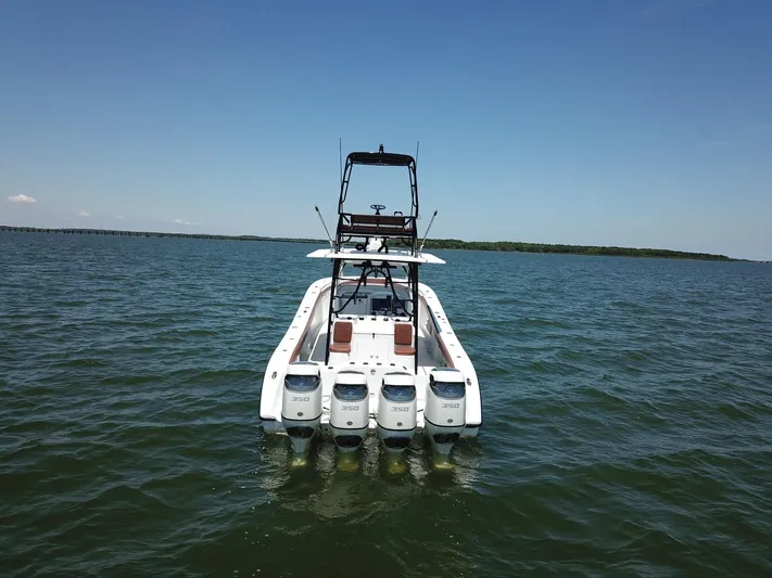  Yacht Photos Pics 2008 Yellowfin 42 boat with multiple outboard engines on open water.