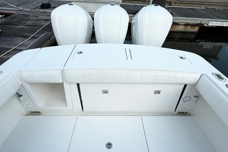  Yacht Photos Pics 2015 Regulator 34 boat with triple outboard engines at dock.